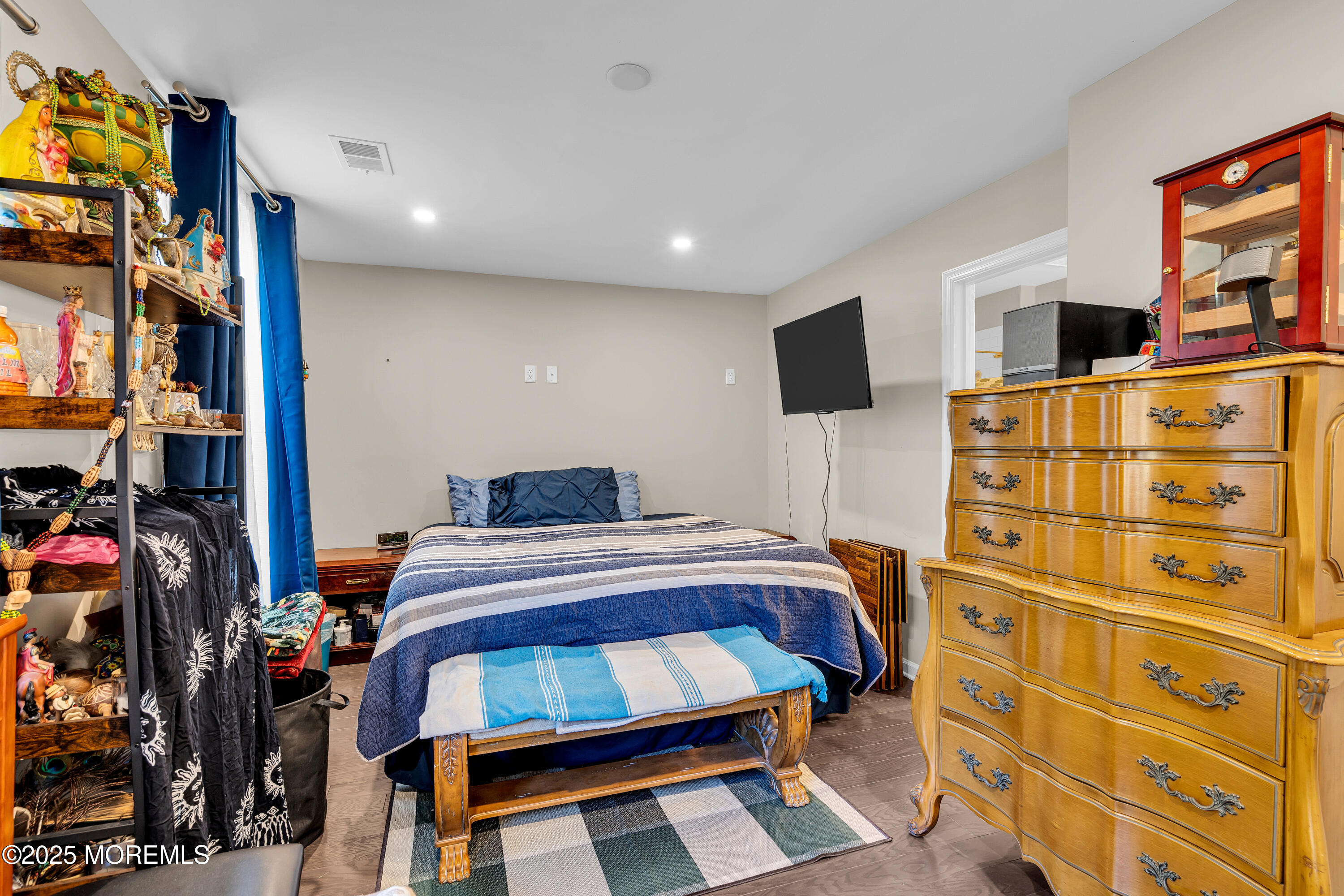 305 Spirit Way, Unit 505 Brick, NJ 08723 - Photo 6 of 28 a bedroom with a bed and a flat tv screen