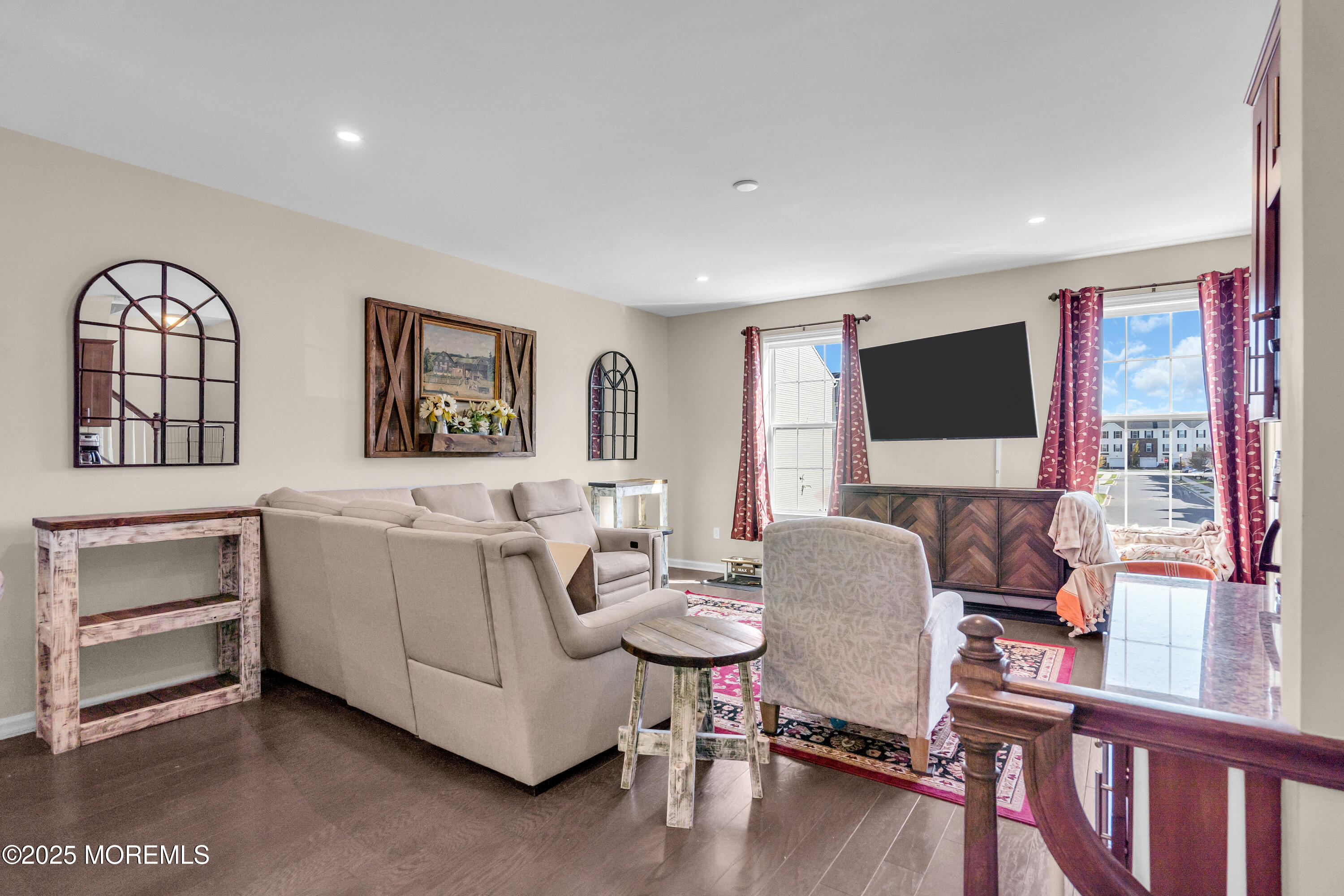 305 Spirit Way, Unit 505 Brick, NJ 08723 - Photo 8 of 28 a living room with furniture a flat screen tv and a window