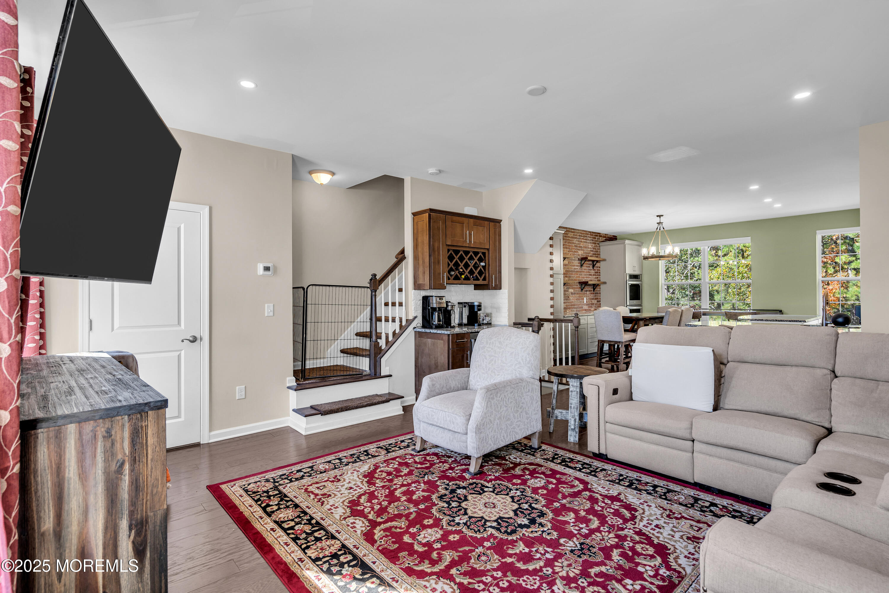 305 Spirit Way, Unit 505 Brick, NJ 08723 - Photo 10 of 28 a living room with furniture and a flat screen tv
