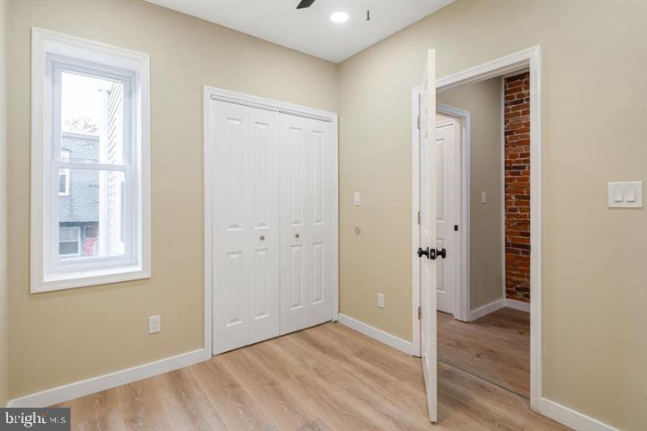 921 South Alden Street Philadelphia, PA 19143 - Photo 20 of 28 a view of an empty room with wooden floor and a window