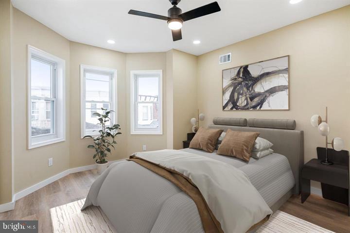 921 South Alden Street Philadelphia, PA 19143 - Photo 22 of 28 a bedroom with a large bed and a window