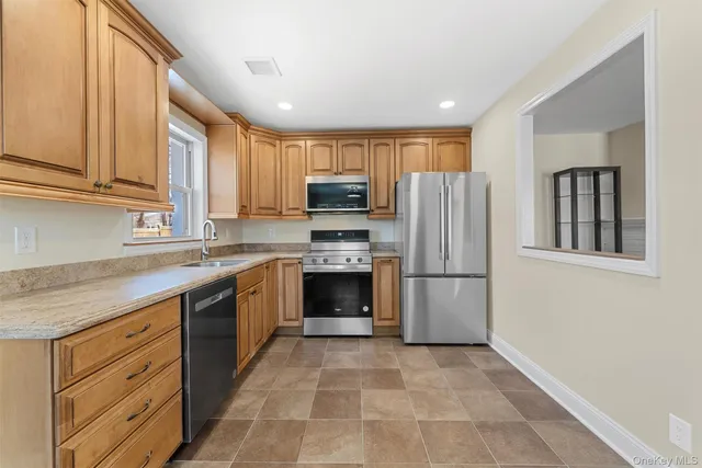 a kitchen with a refrigerator sink and microwave