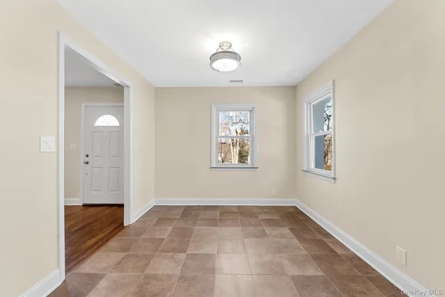 a view of an empty room and window