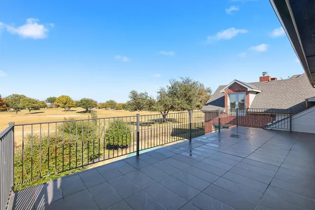 a view of a livingroom with furniture and a window