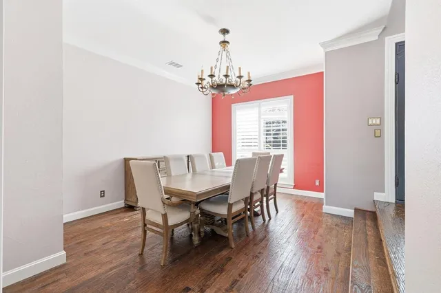 a very nice looking living room with hardwood floor and a large window