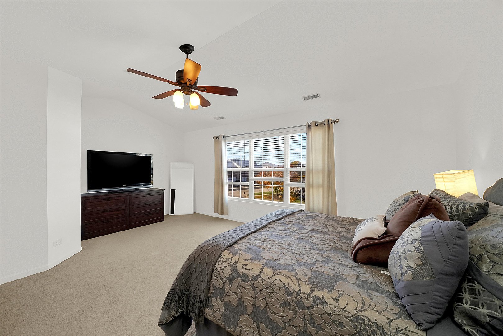 1956 West Cobblestone Road Romeoville, IL 60446 - Photo 10 of 14 a bedroom with a bed and a television