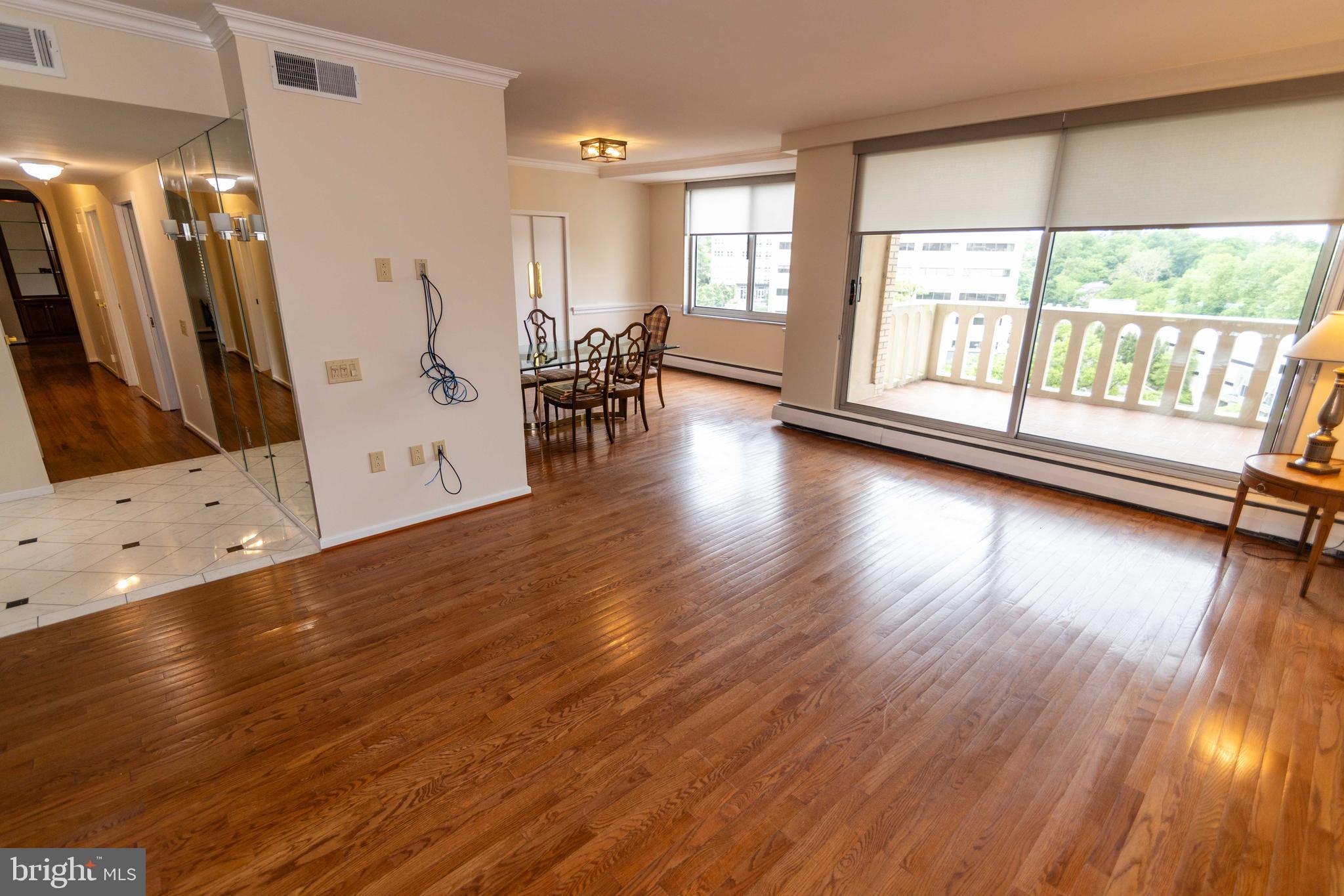 191 Presidential Boulevard, Unit R721722 Bala Cynwyd, PA 19004 - Photo 7 of 37 Sunlit Open Living and Dining Spaces