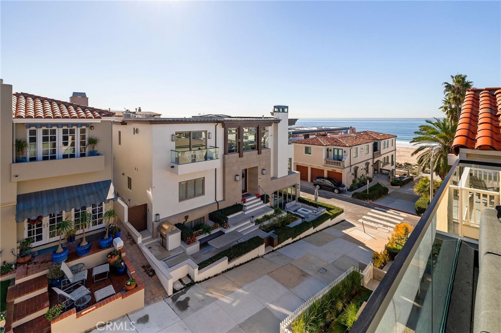 121 25th Street Manhattan Beach, CA 90266 - Photo 12 of 75 a view of a balcony with plants and wooden floor