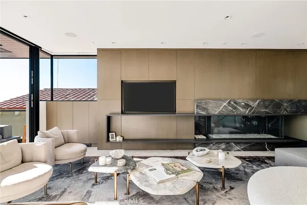 a kitchen with stainless steel appliances kitchen island granite countertop a refrigerator and a sink