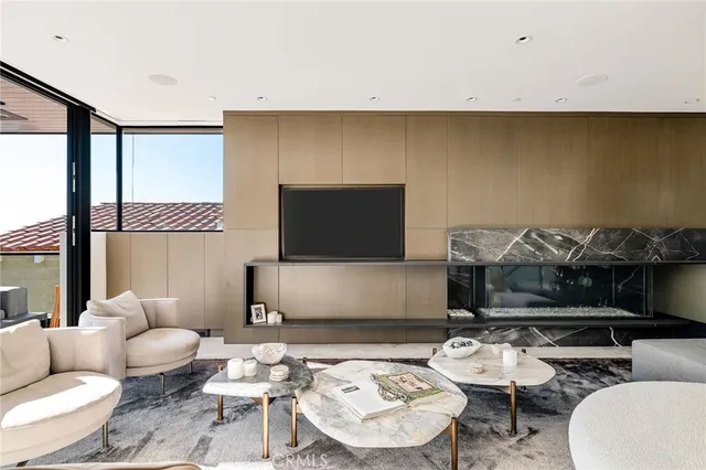a kitchen with stainless steel appliances kitchen island granite countertop a refrigerator and a sink