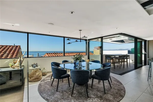 a living room with lots of furniture and a chandelier