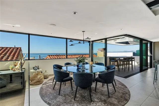 a living room with lots of furniture and a chandelier