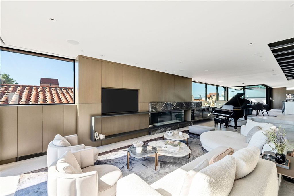 121 25th Street Manhattan Beach, CA 90266 - Photo 22 of 75 a living room with furniture and a flat screen tv