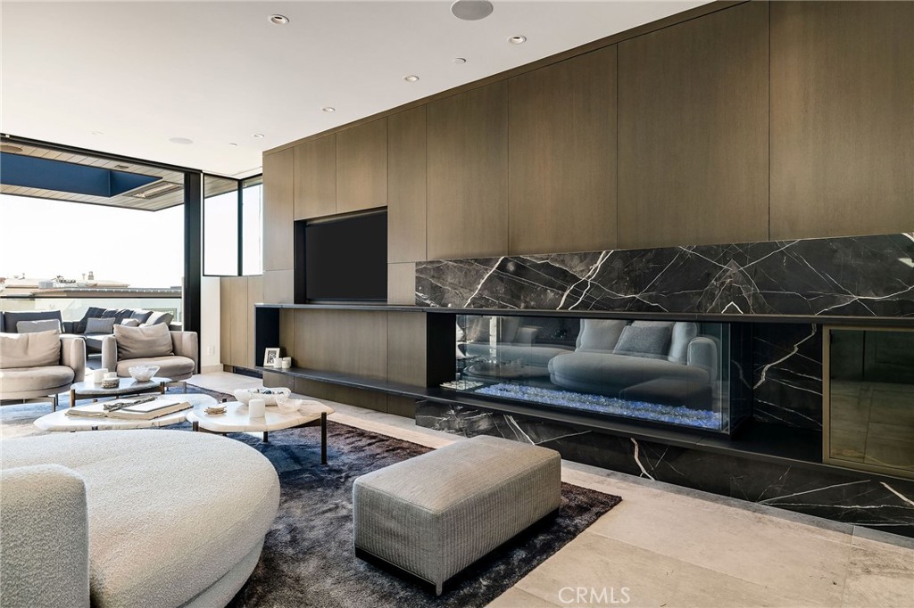 121 25th Street Manhattan Beach, CA 90266 - Photo 25 of 75 a living room with furniture and a flat screen tv