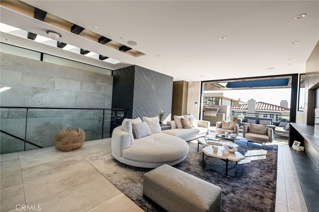 121 25th Street Manhattan Beach, CA 90266 - Photo 26 of 75 a living room with furniture and a large window