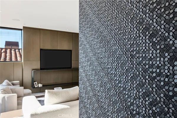 a room with table chairs and a large window