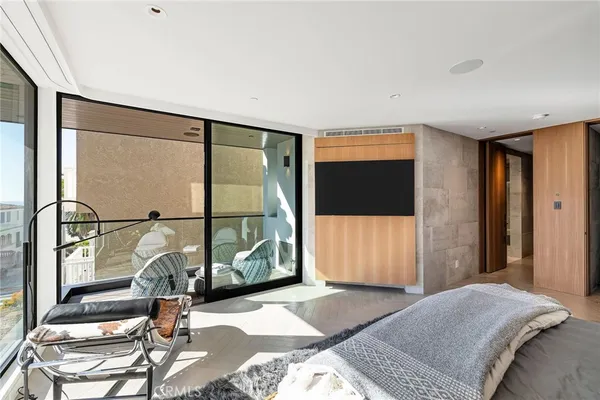 a bedroom with a bed and a tv