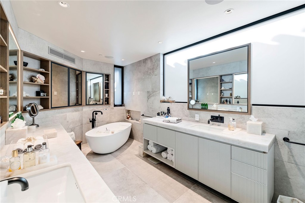121 25th Street Manhattan Beach, CA 90266 - Photo 42 of 75 a spacious bathroom with a double vanity sink double and mirror