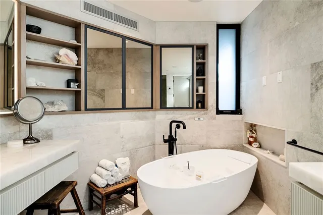 a bathroom with a sink a toilet and a shower