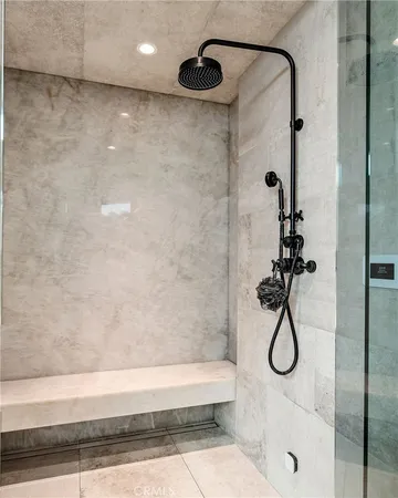 a living room with furniture gym equipment and a large window