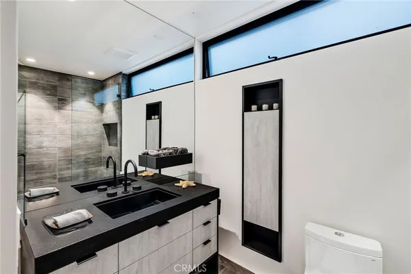 a room with gym equipment and large mirror