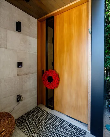 a view of a balcony with plants and wooden floor