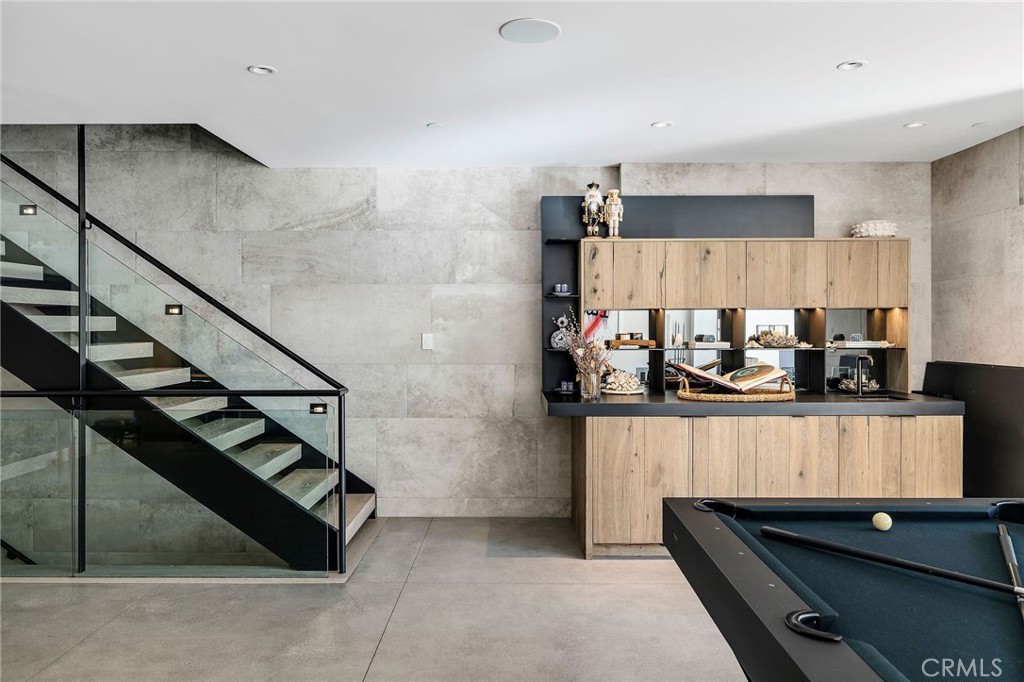 121 25th Street Manhattan Beach, CA 90266 - Photo 53 of 75 a kitchen with stainless steel appliances granite countertop a sink and cabinets