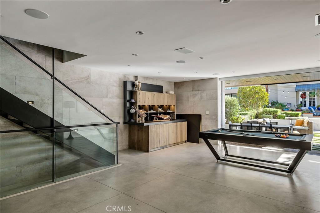 121 25th Street Manhattan Beach, CA 90266 - Photo 55 of 75 a room with table chairs and a large window