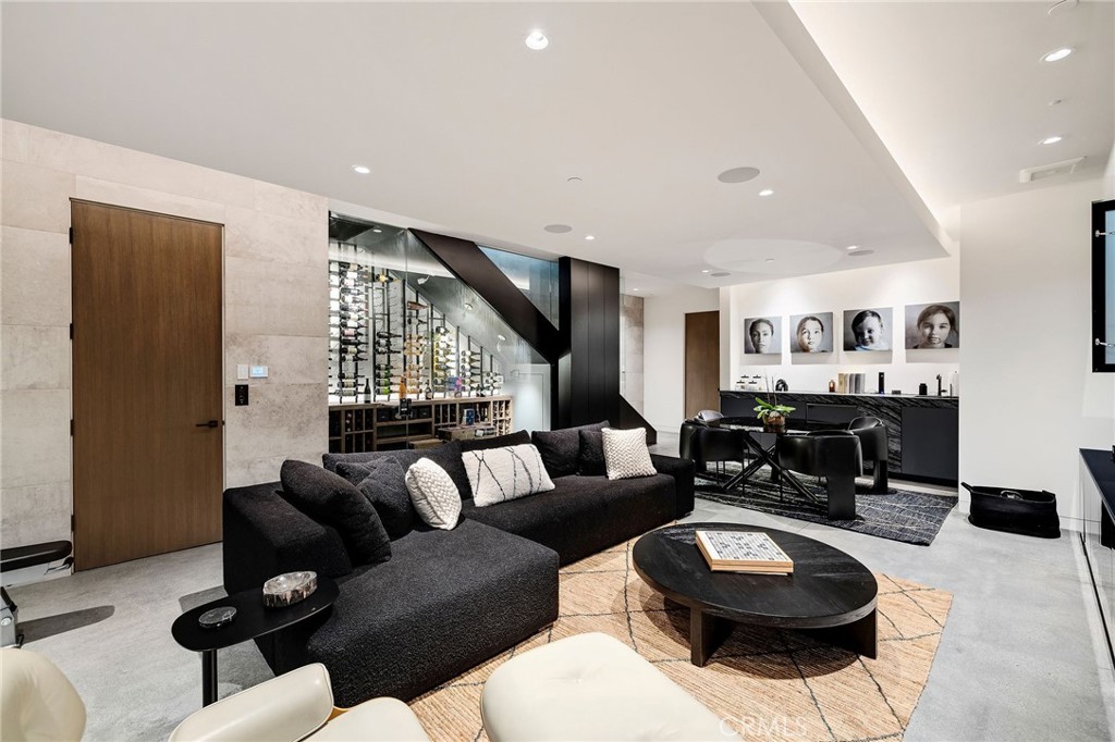 121 25th Street Manhattan Beach, CA 90266 - Photo 63 of 75 a living room with furniture a rug and a window