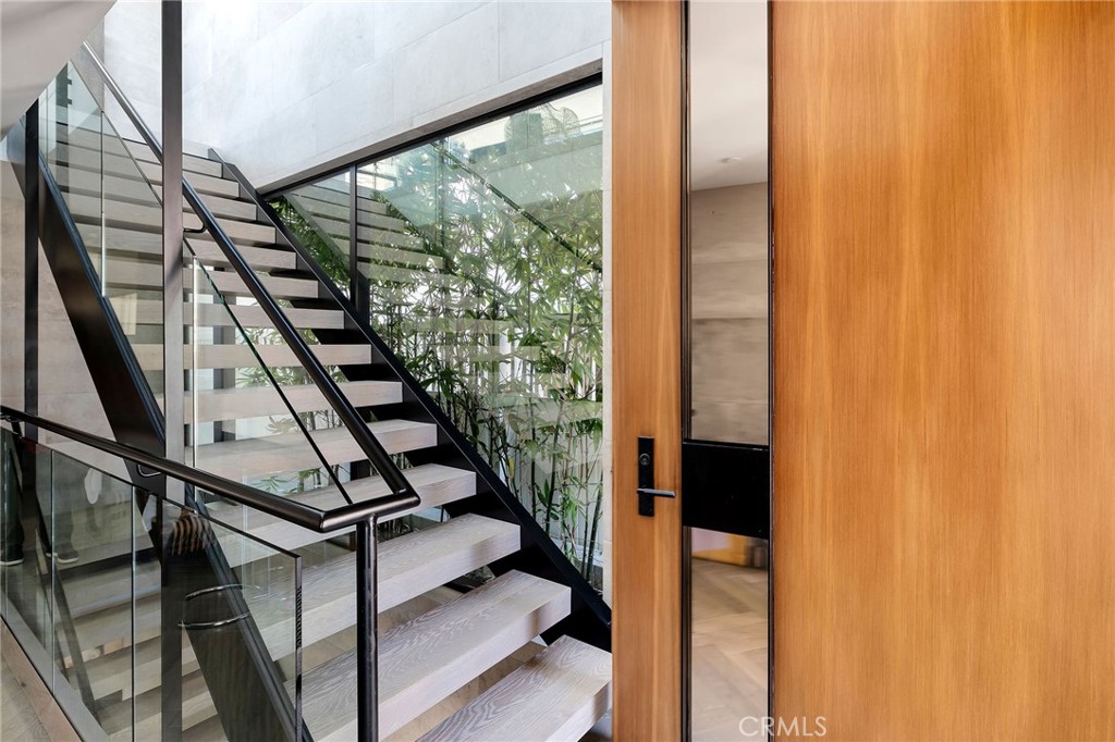 121 25th Street Manhattan Beach, CA 90266 - Photo 8 of 75 a view of entryway with wooden floor and stairs