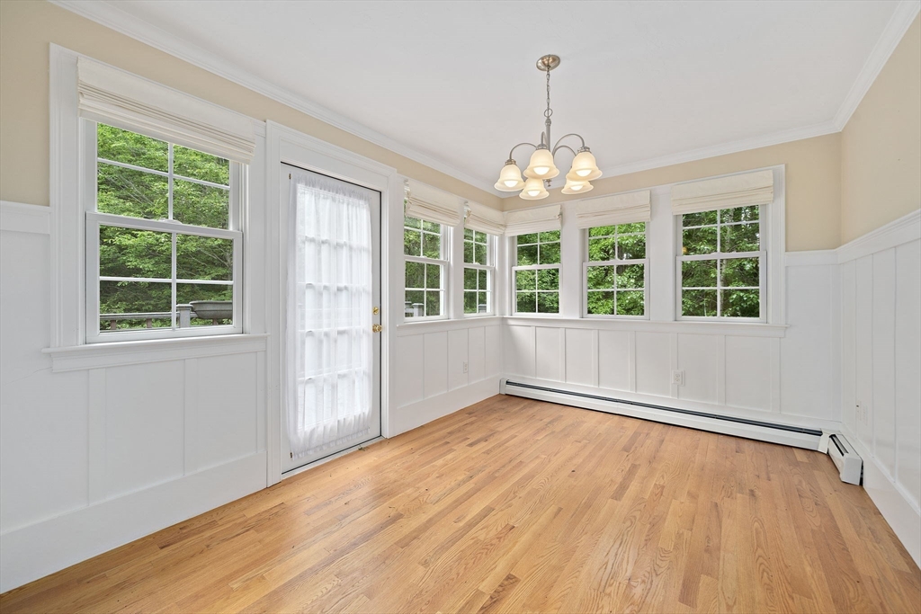 14 Sugar Maple Circle, Unit 14 Hanover, MA 02339 - Photo 12 of 38 an empty room with wooden floor and windows