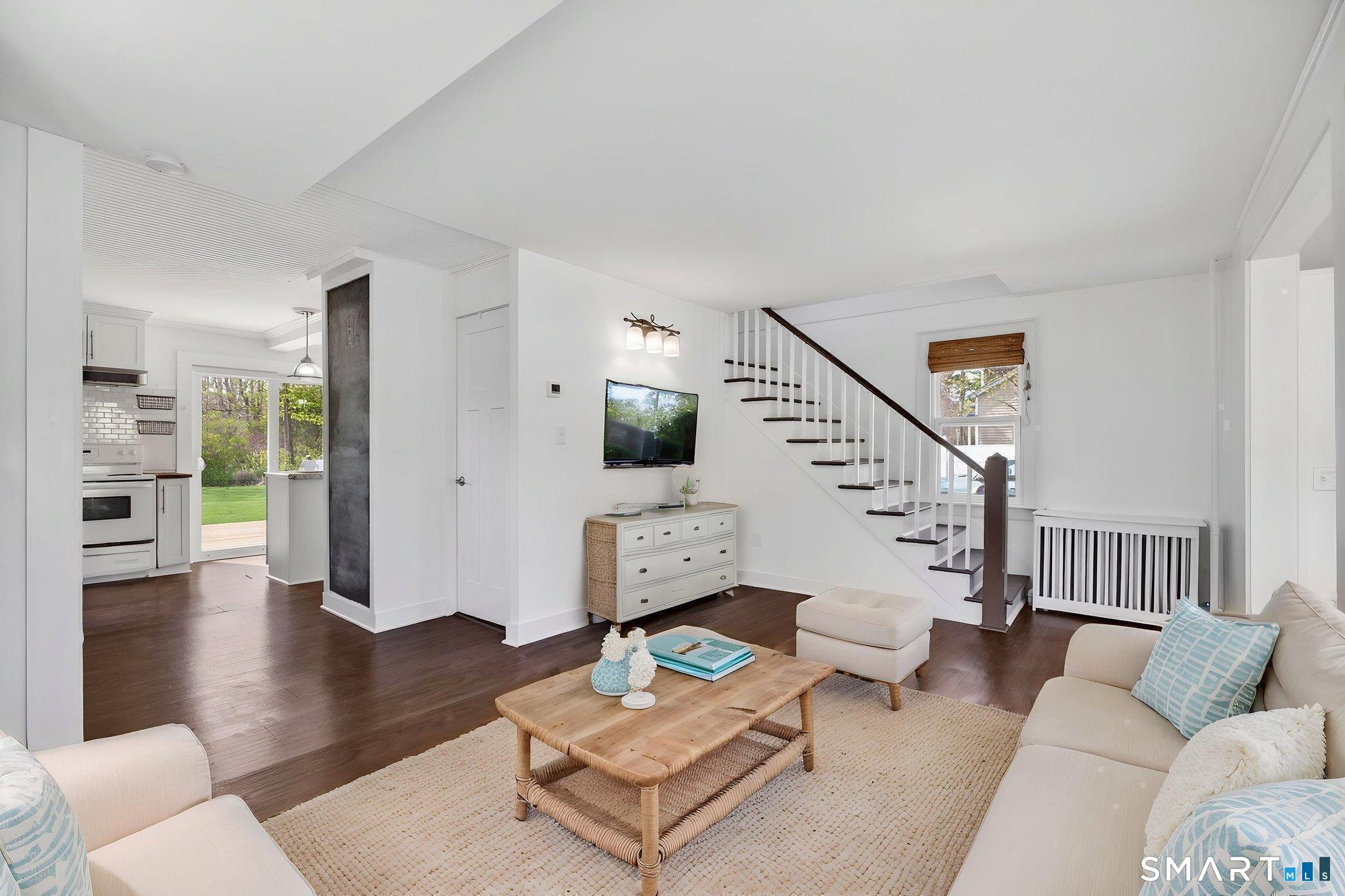 61 Ingham Hill Road Old Saybrook, CT 06475 - Photo 12 of 32 a living room with furniture and wooden floor