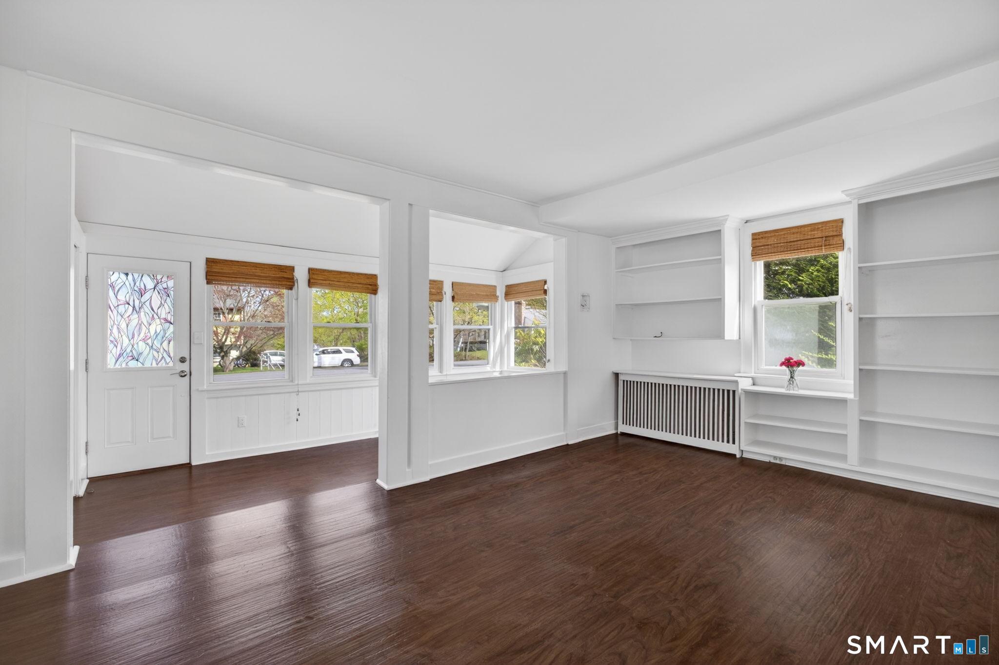 61 Ingham Hill Road Old Saybrook, CT 06475 - Photo 15 of 32 wooden floor in an empty room with a window
