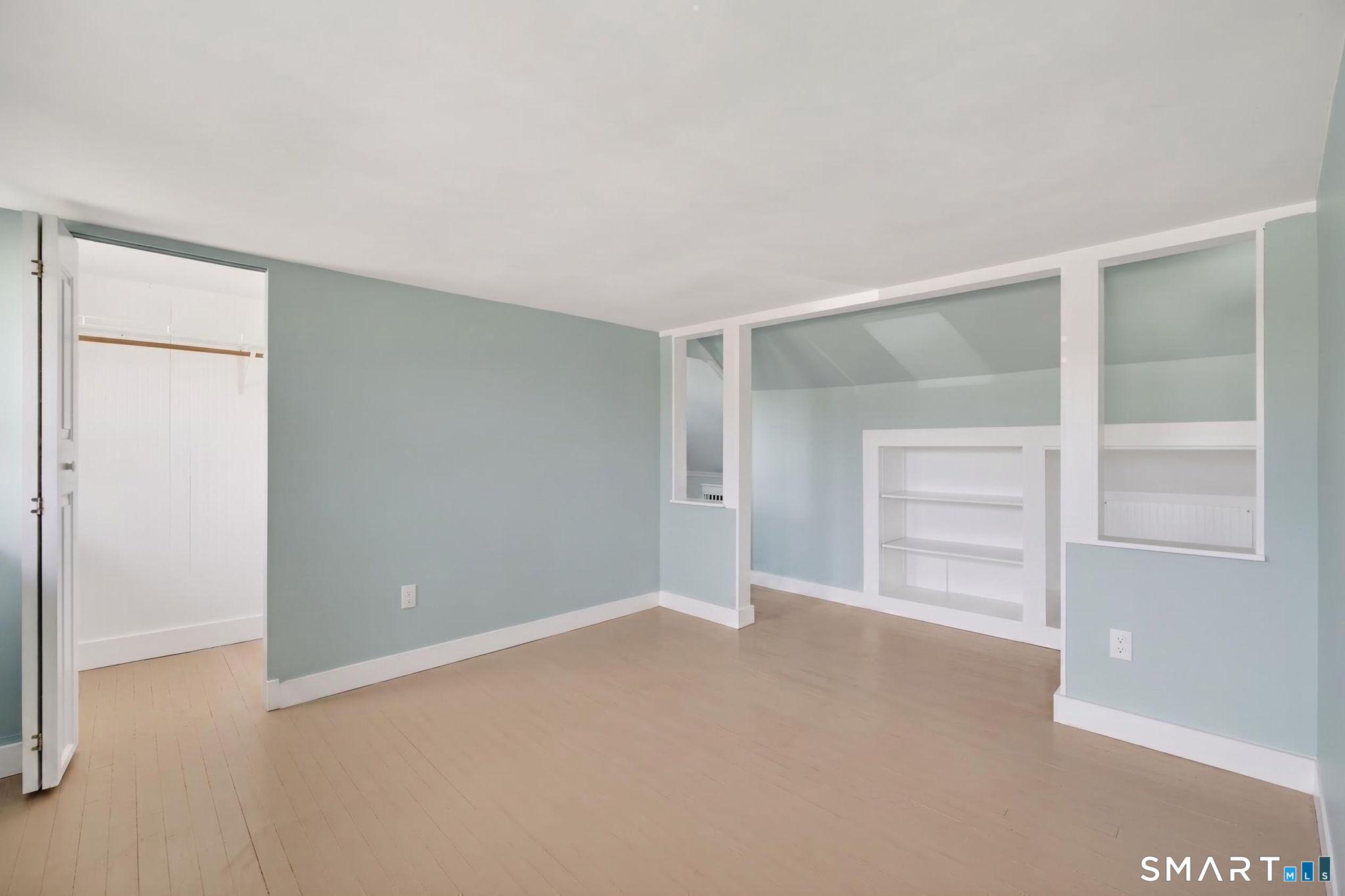 61 Ingham Hill Road Old Saybrook, CT 06475 - Photo 18 of 32 a view of an empty room with a closet