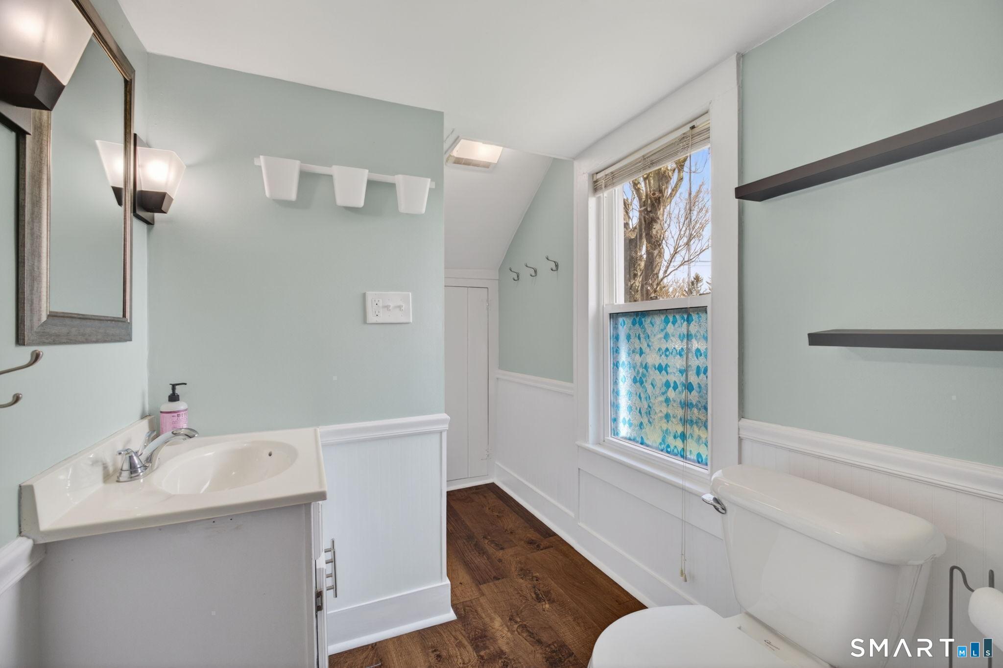 61 Ingham Hill Road Old Saybrook, CT 06475 - Photo 20 of 32 a bathroom with a sink and a mirror