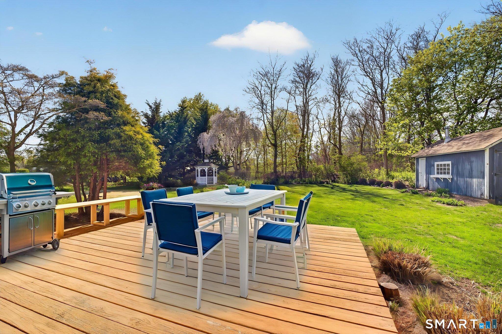 61 Ingham Hill Road Old Saybrook, CT 06475 - Photo 23 of 32 a view of a dining tables and chairs in the patio