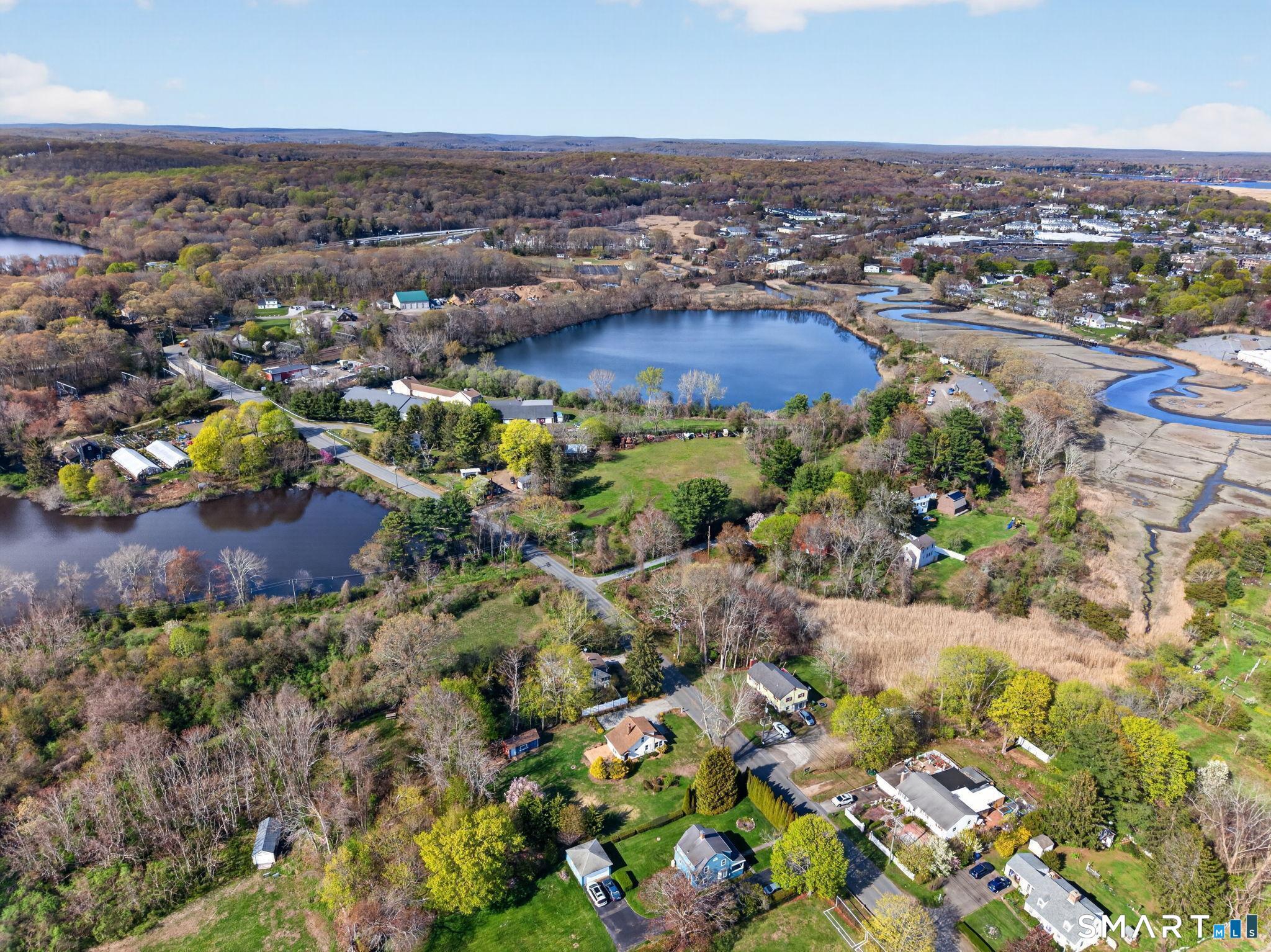 61 Ingham Hill Road Old Saybrook, CT 06475 - Photo 30 of 32 an aerial view of residential houses with outdoor space
