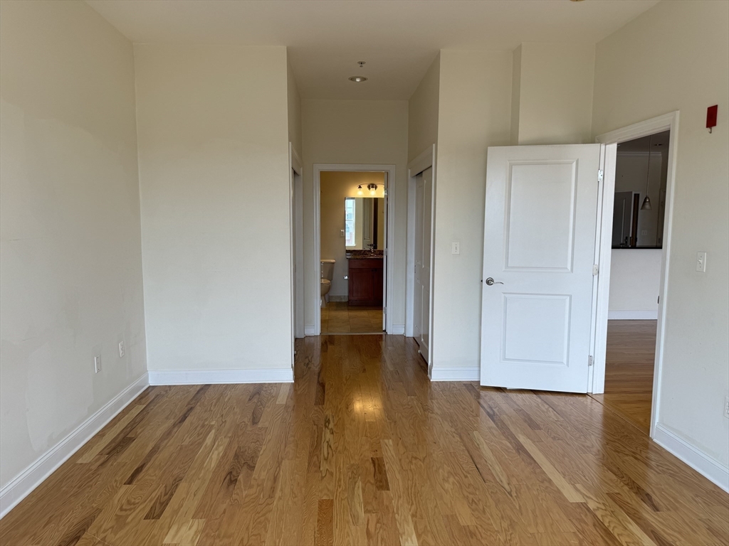 500 Union Street, Unit 5304 Westborough, MA 01581 - Photo 14 of 26 a view of a hallway with wooden floor