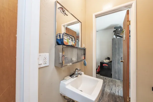 a bathroom with a sink and mirror