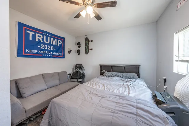 a bedroom with bed and a window