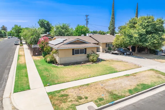 a view of house with swimming pool