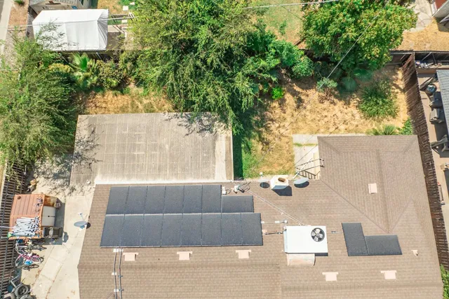 a view of a balcony with chairs and wooden floor
