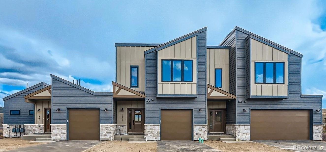 1301 James Drive Tabernash, CO 80478 - Photo 2 of 33 a front view of a house with a garage
