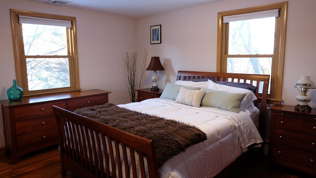 182 Governors Road Quincy, MA 02169 - Photo 11 of 15 a bedroom with a bed and a window
