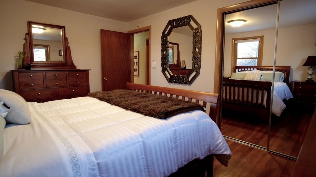 182 Governors Road Quincy, MA 02169 - Photo 12 of 15 a bedroom with a large bed and a dresser