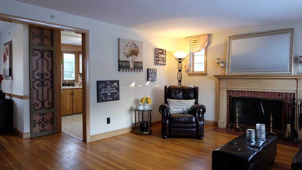 182 Governors Road Quincy, MA 02169 - Photo 3 of 15 a living room with furniture and a fireplace