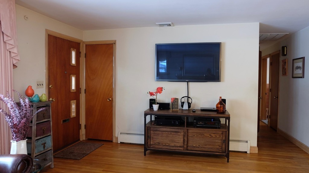 182 Governors Road Quincy, MA 02169 - Photo 4 of 15 a living room with furniture and wooden floor