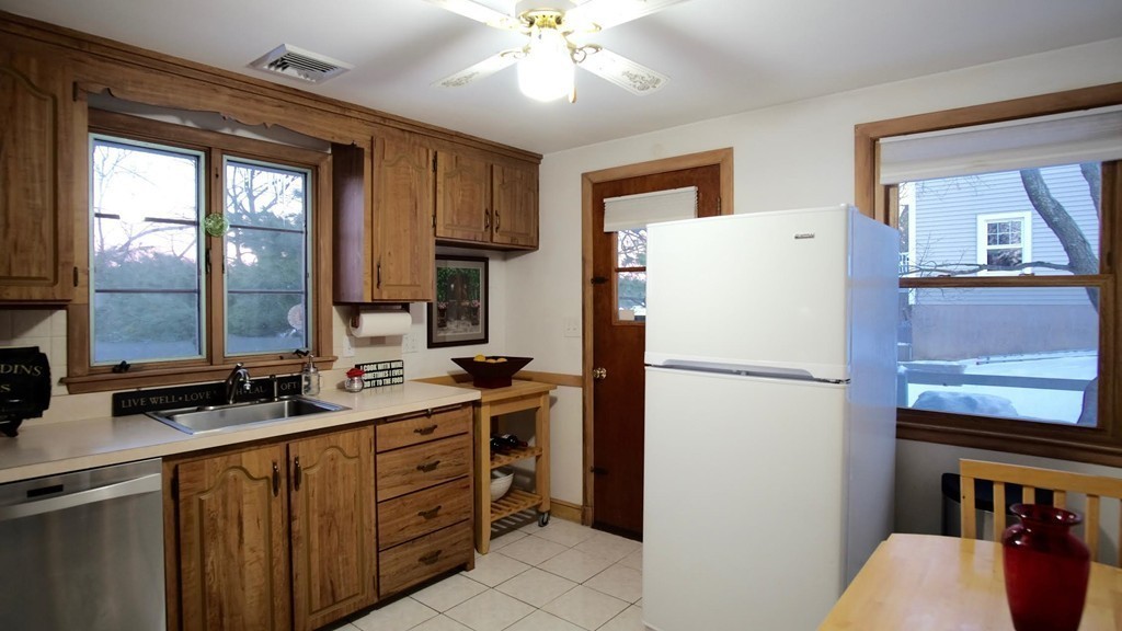182 Governors Road Quincy, MA 02169 - Photo 6 of 15 a white refrigerator freezer sitting inside of a kitchen