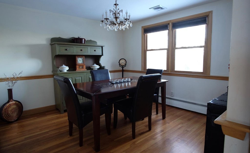 182 Governors Road Quincy, MA 02169 - Photo 7 of 15 a view of a dining room with furniture window and wooden floor