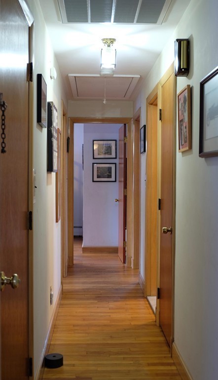 182 Governors Road Quincy, MA 02169 - Photo 8 of 15 a view of a hallway with wooden floor